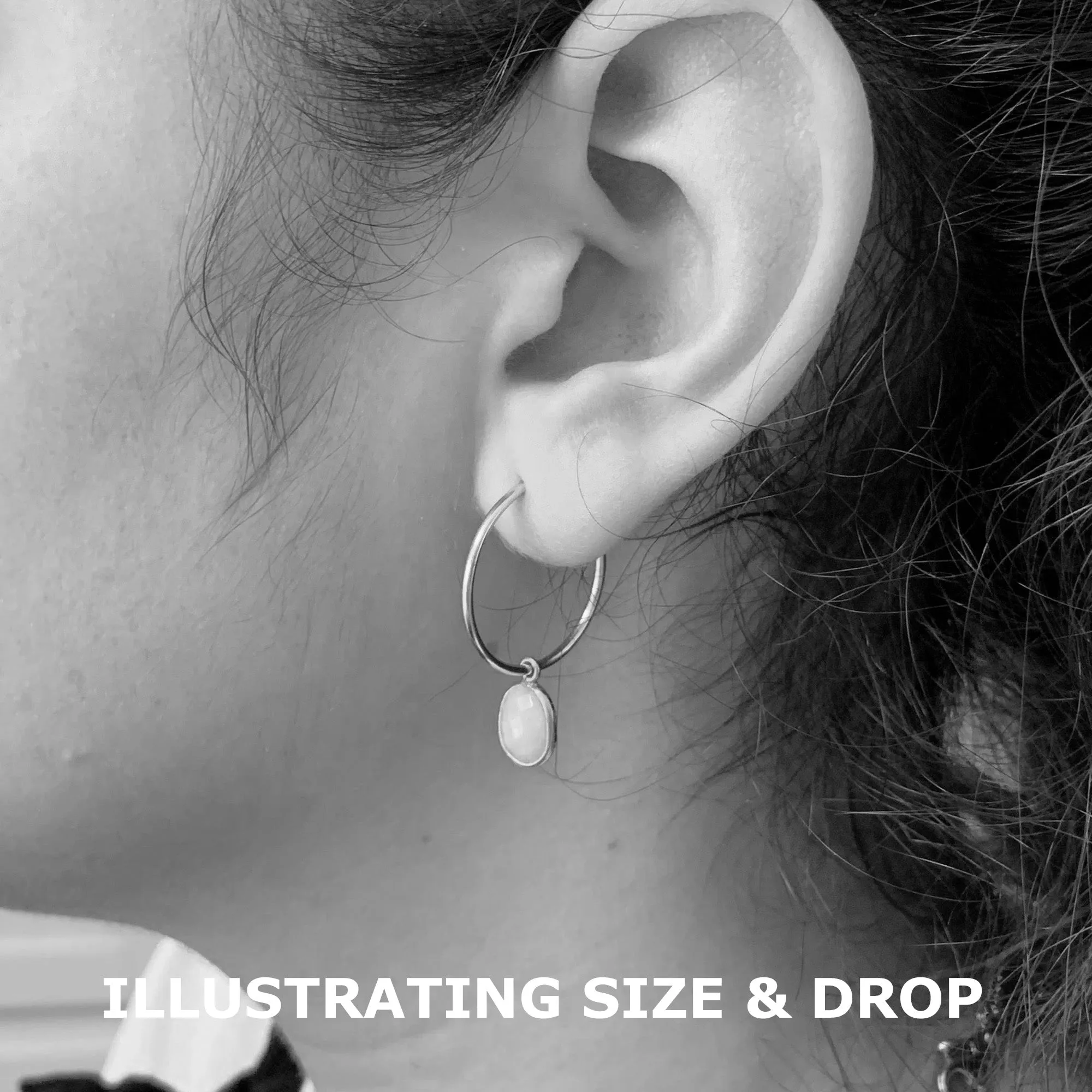 Gemstone earrings with turquoise (blue) oval crystal drops on silver medium hoops