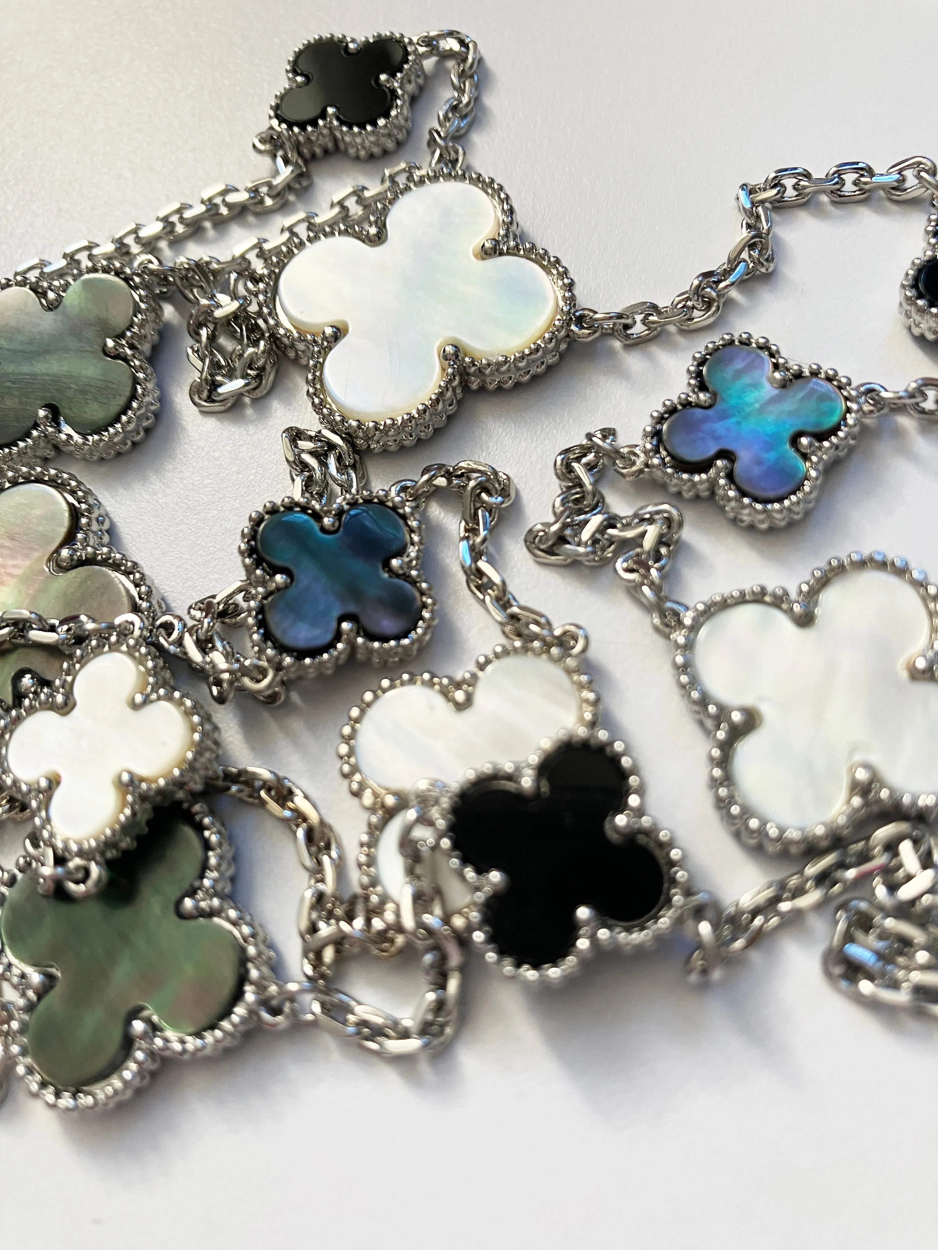 Mixed Size Onyx and White and Gray Mother of Pearl Quatrefoil Silver Plated Necklace