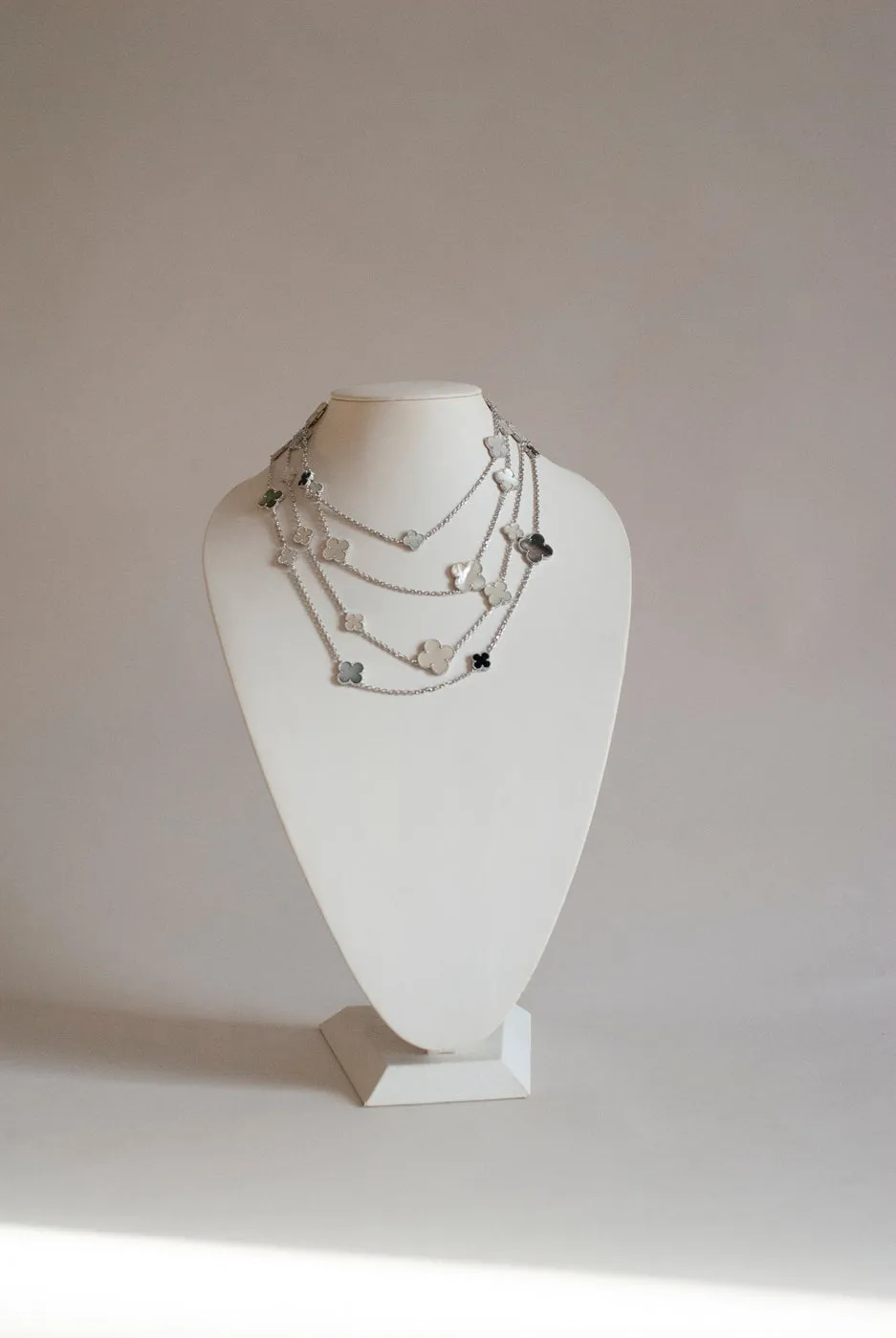 Mixed Size Onyx and White and Gray Mother of Pearl Quatrefoil Silver Plated Necklace